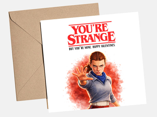 Funny Valentine‚Äôs Day card with text ‚Äúyou‚Äôre strange and I love you‚Äù, quirky affectionate love card for him or her