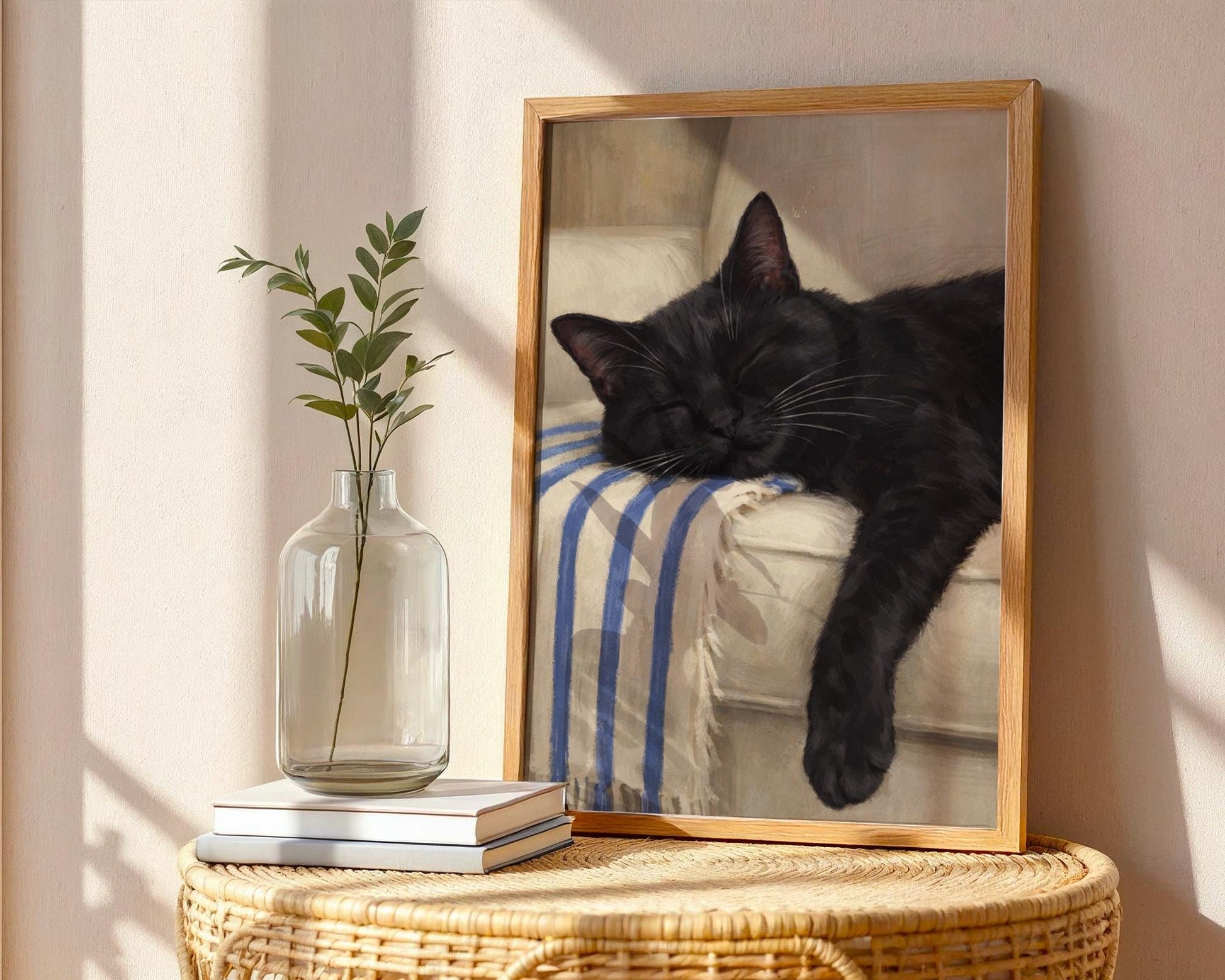 Black cat sleeping on couch wall art, cozy living room decor with soft neutral tones