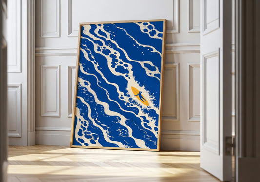 Blue surf wall art featuring a lone surfer riding through abstract ocean waves