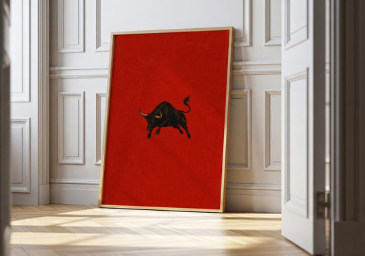Spanish toro wall art featuring a black bull on a rich crimson background