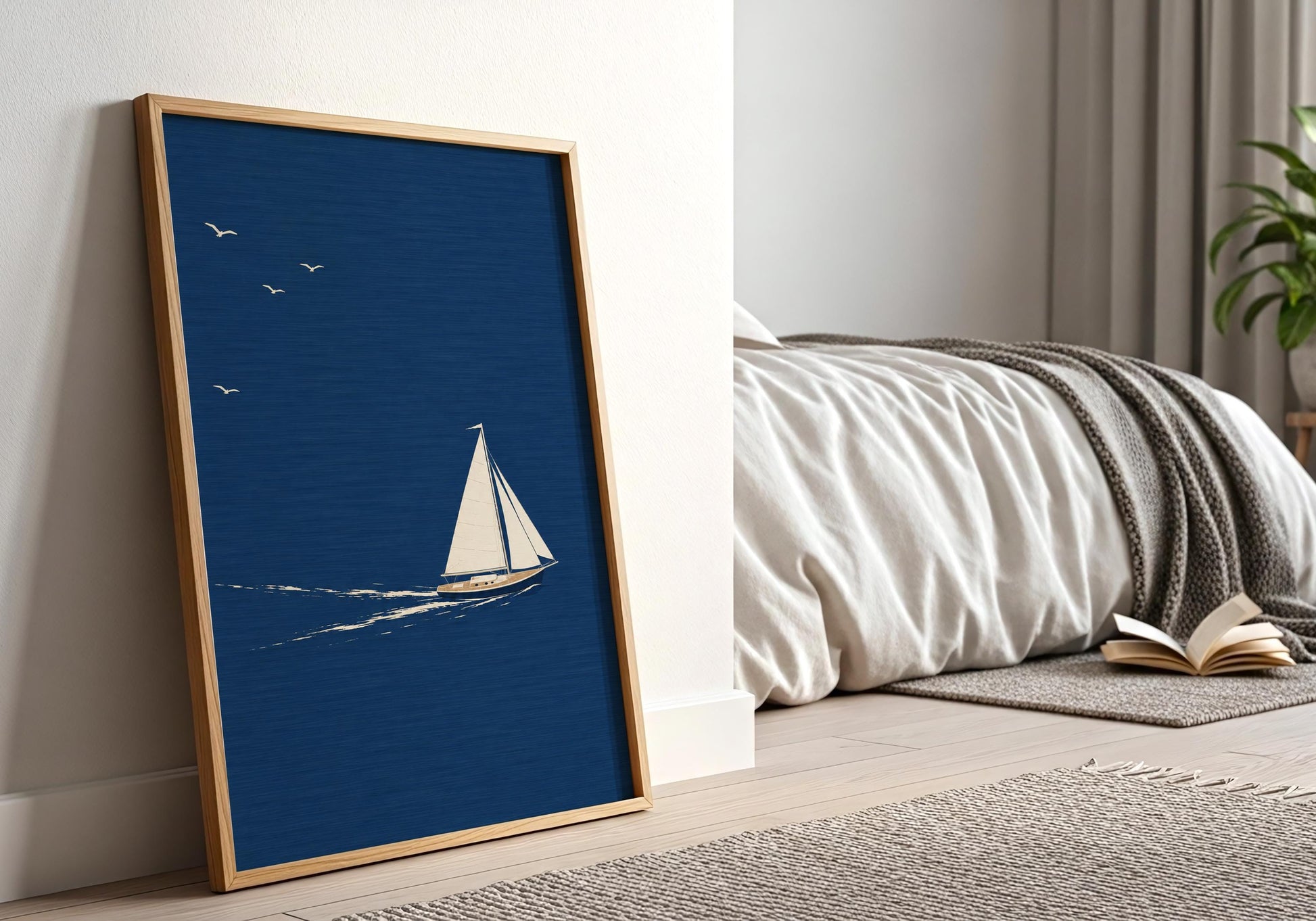 Coastal wall art print with a lone sailboat gliding through calm blue waters in a minimalist style.