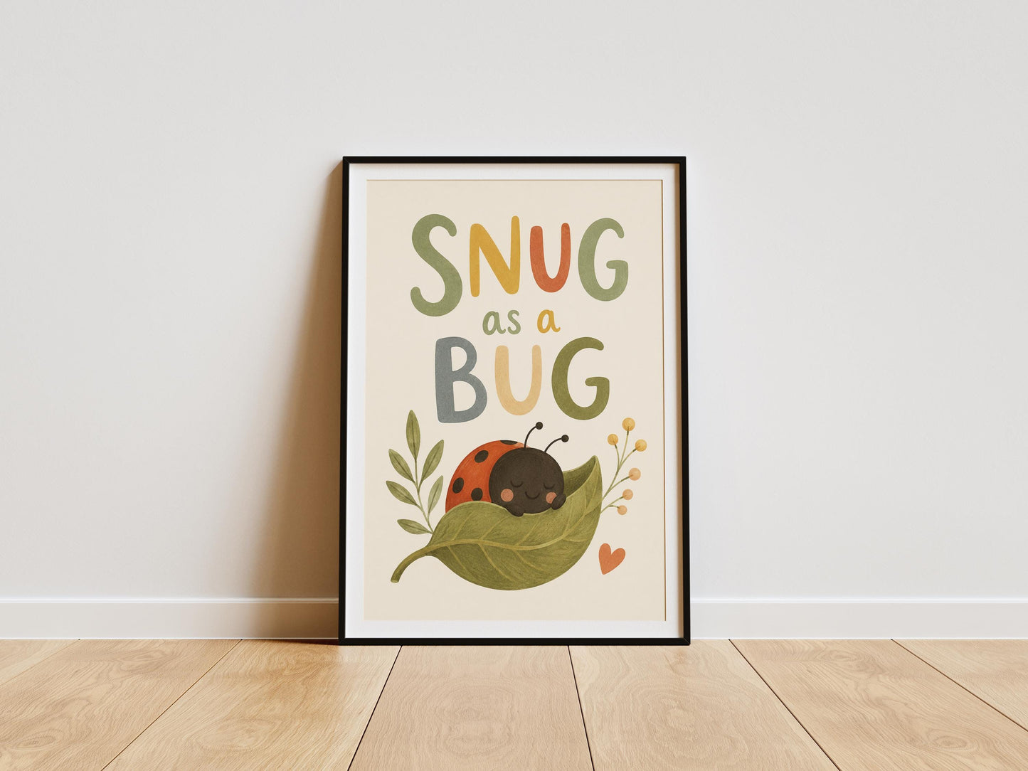 Snug As A Bug nursery wall art featuring a sleeping ladybird on a green leaf.
