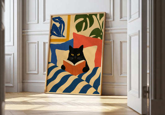Modern color block artwork featuring a black cat reading an orange book with bold abstract shapes.