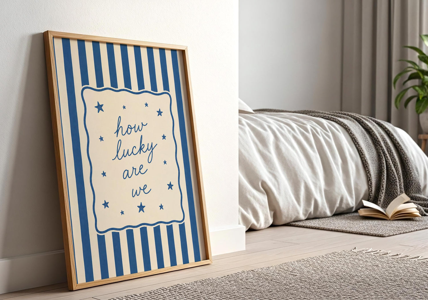 Blue quote wall art featuring the How Lucky Are We phrase in a minimalist design.