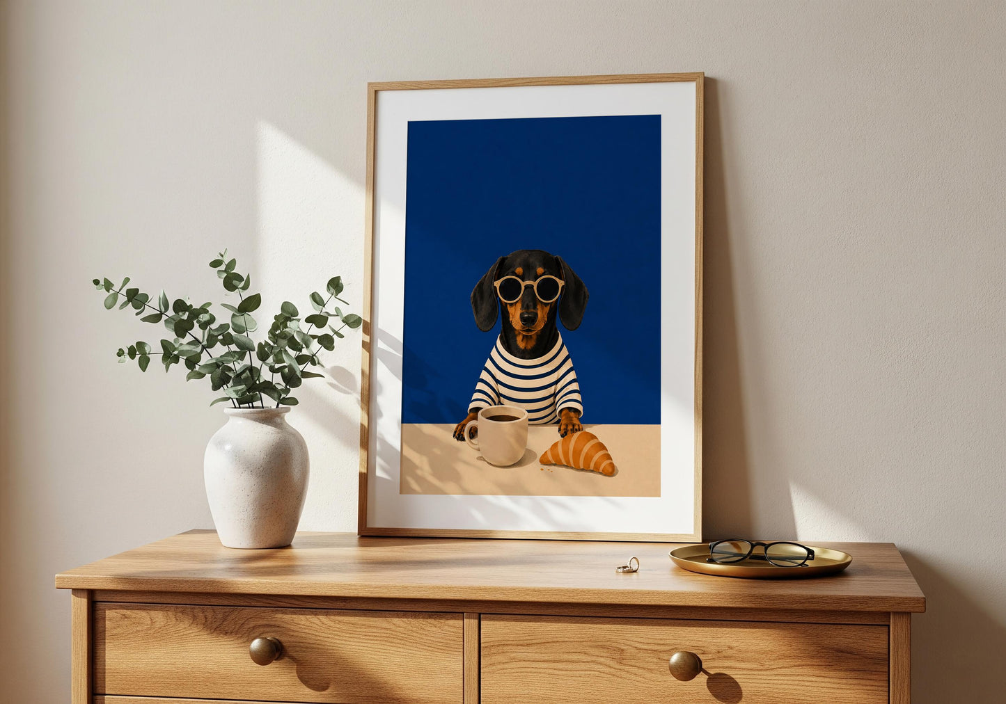 Modern dog kitchen decor with a Dachshund enjoying coffee and a croissant.