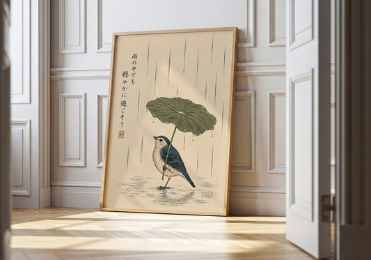 Japanese-inspired bird wall art featuring a small bird sheltering beneath a lotus leaf during gentle rainfall with a calming mindfulness quote.