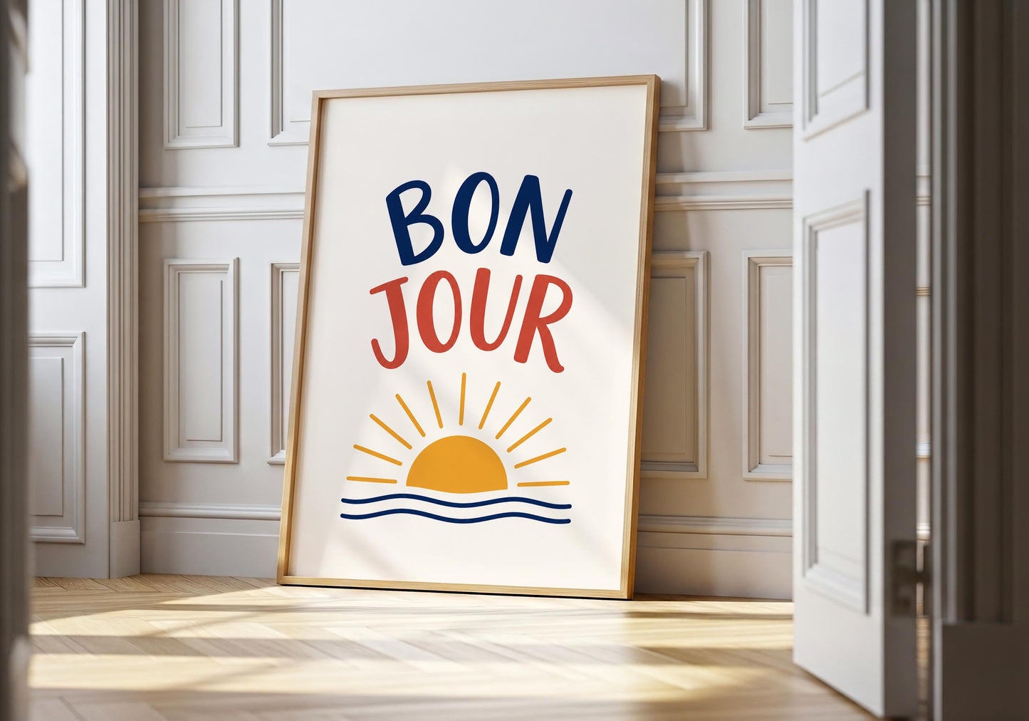 Bonjour wall art featuring bold French typography with a minimalist sunrise illustration.