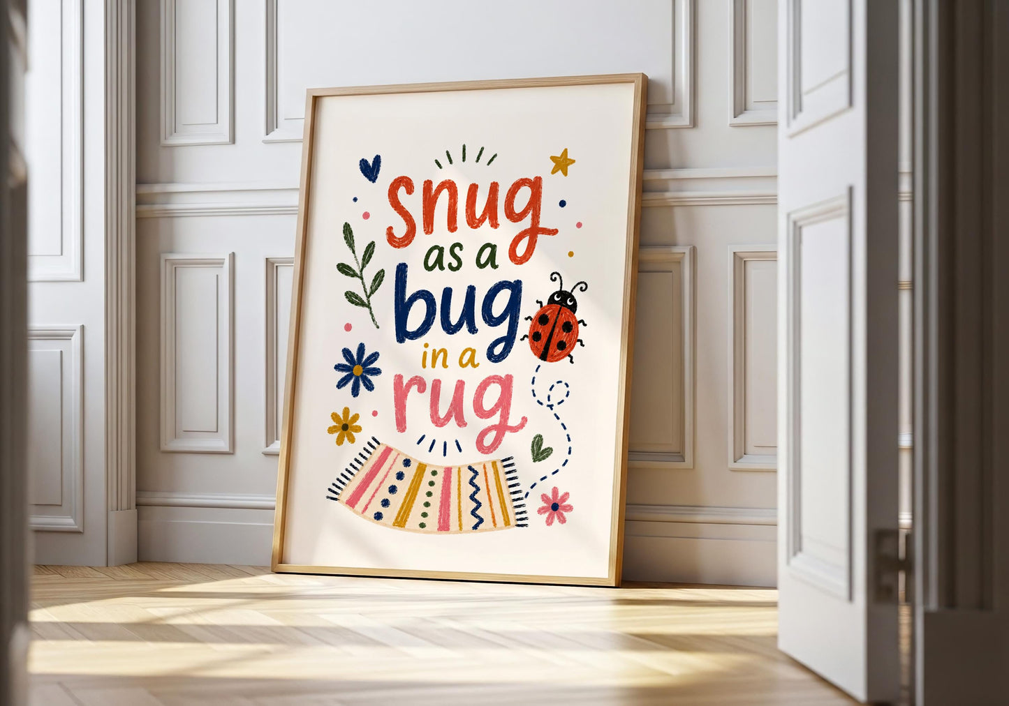 Snug as a Bug in a Rug nursery quote print with colourful typography and a cute ladybird illustration.
