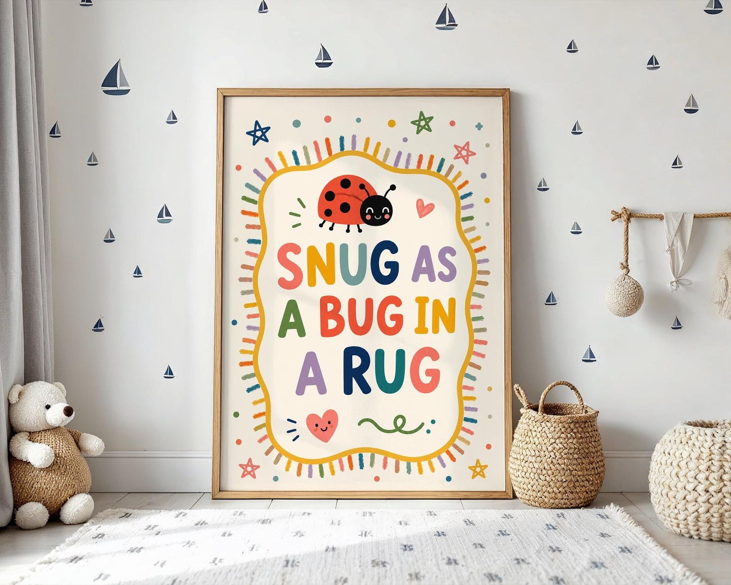 Nursery wall art featuring the Snug As A Bug In A Rug quote with whimsical stars and hearts.