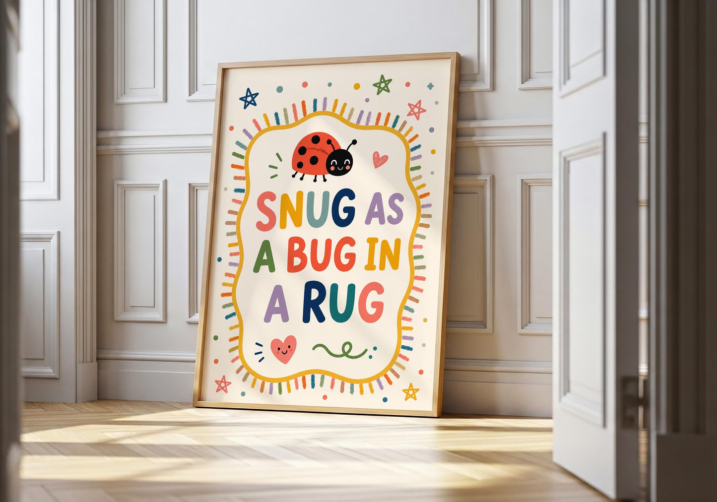 Snug As A Bug In A Rug nursery wall art featuring colourful typography and a smiling ladybird illustration.