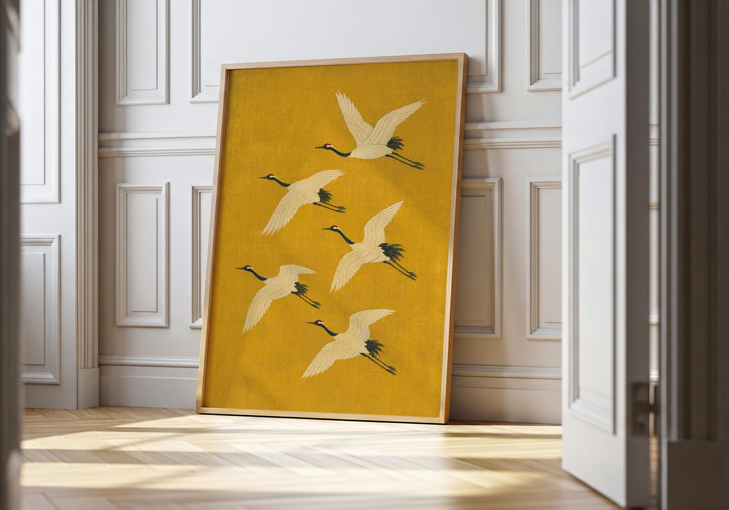 Japanese crane wall art featuring five elegant flying cranes against a rich golden ochre background in a minimalist Japandi style.