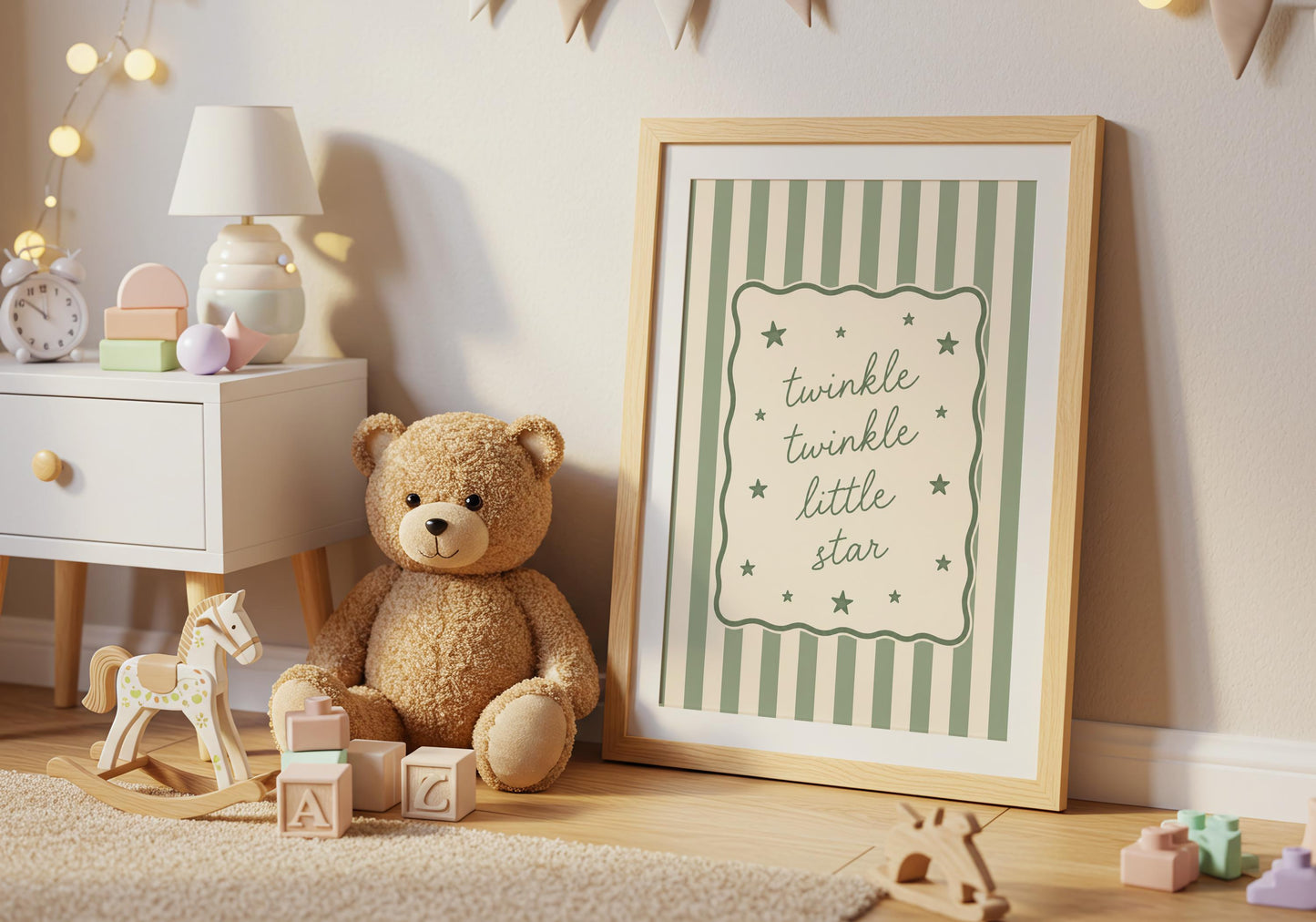 Gender neutral baby room decor with soft green striped nursery artwork.