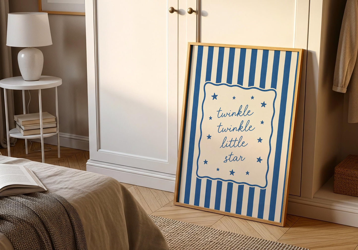 Blue nursery wall art with elegant lettering and whimsical star details.
