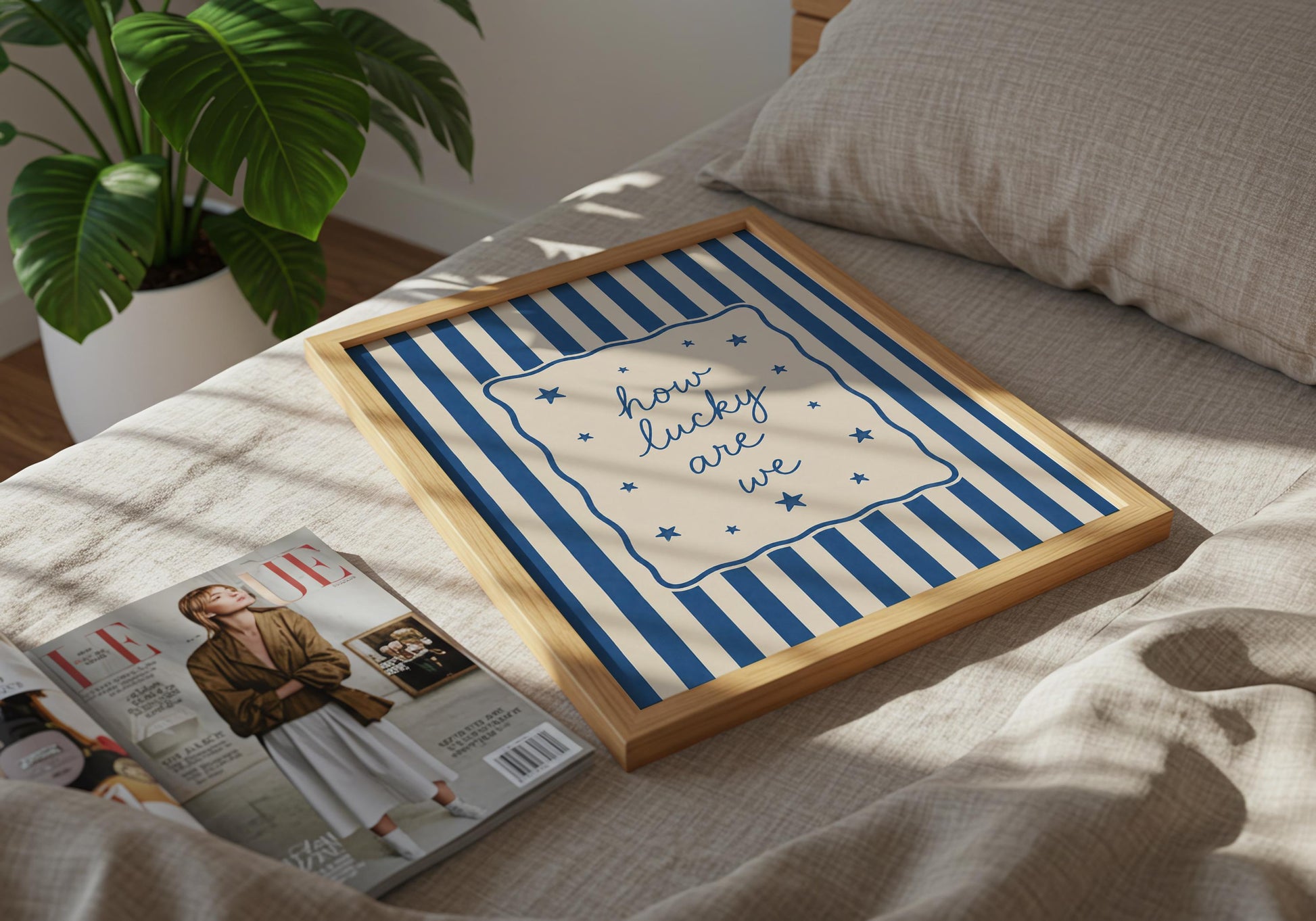 Coastal typography print with blue striped background and decorative stars.