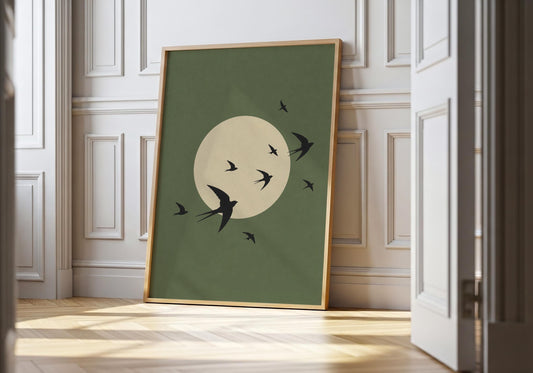 Birds in flight wall art with olive green moon background.