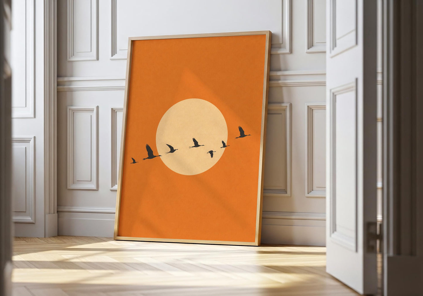 Sunset bird wall art with warm terracotta background.