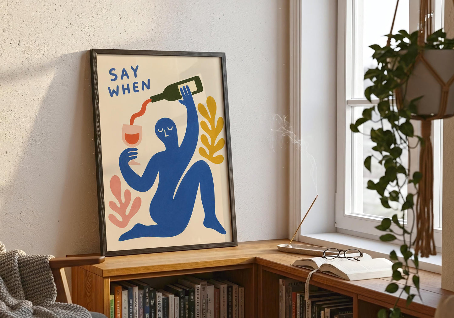 Abstract wine lover print with playful blue figure, pink wine glass and botanical accents for stylish gallery wall décor.