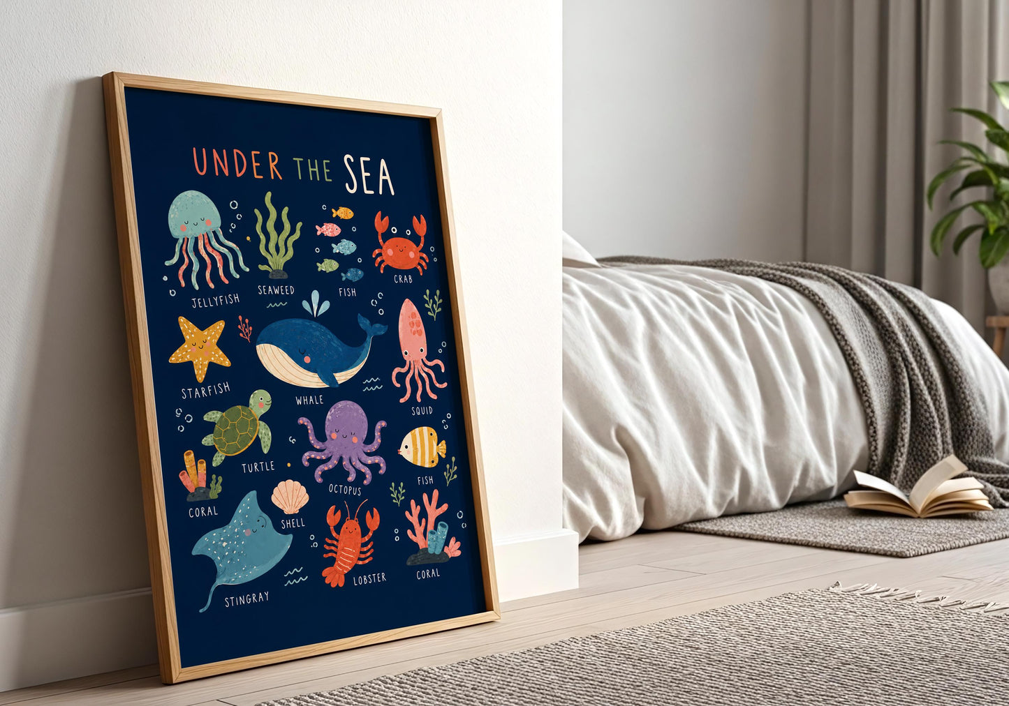 Framed kids ocean poster displayed against a white panelled wall in a bright neutral interior.