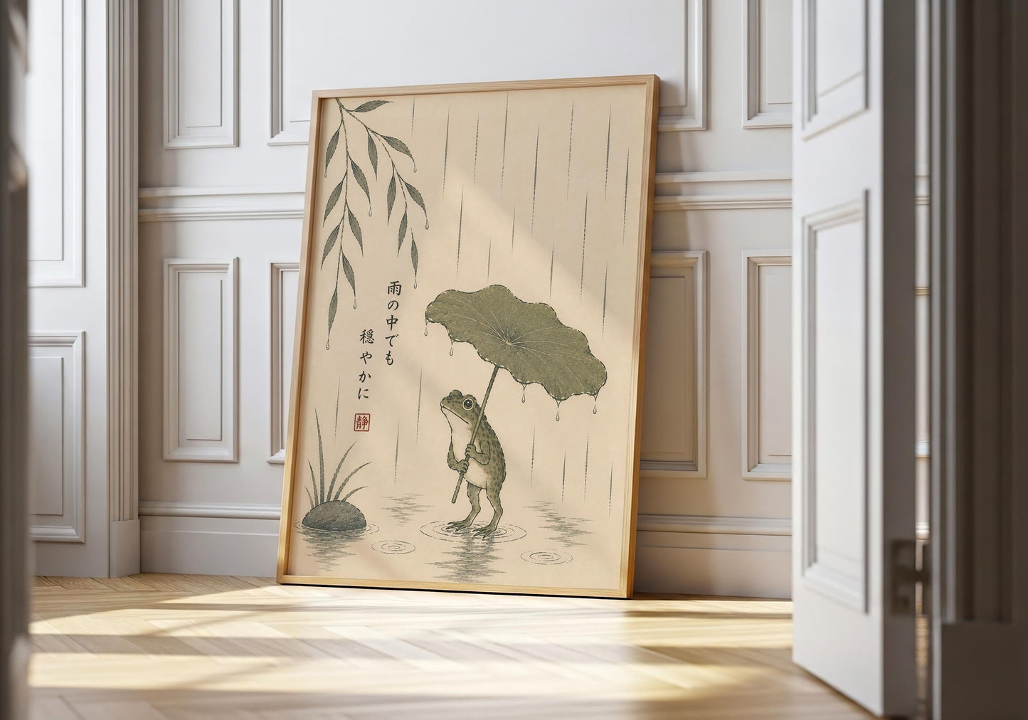 Japanese wall art featuring a frog holding a lotus leaf umbrella in the rain with an inspirational Japanese quote.