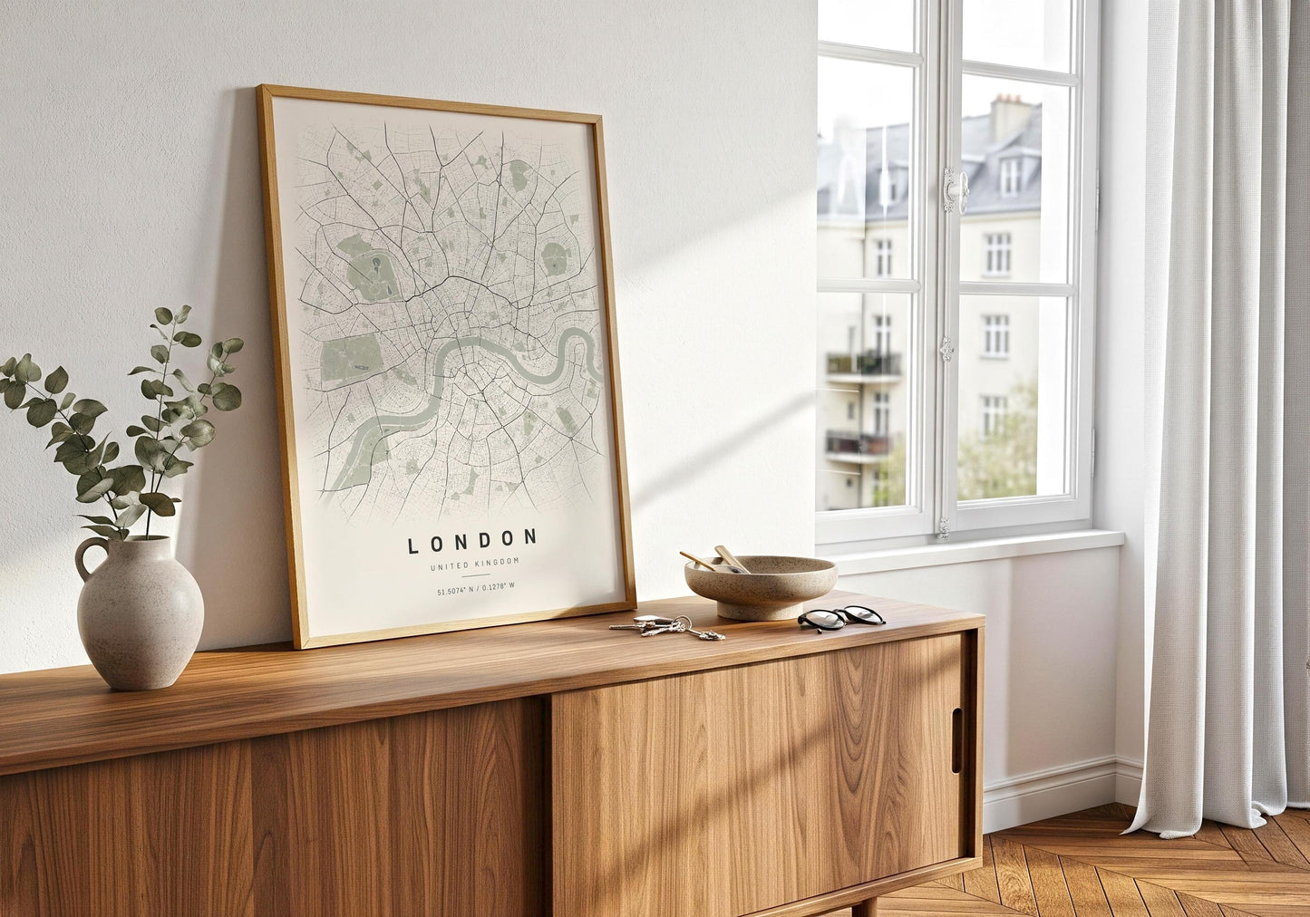 Contemporary London wall decor in a natural wood frame styled against a white panelled wall.