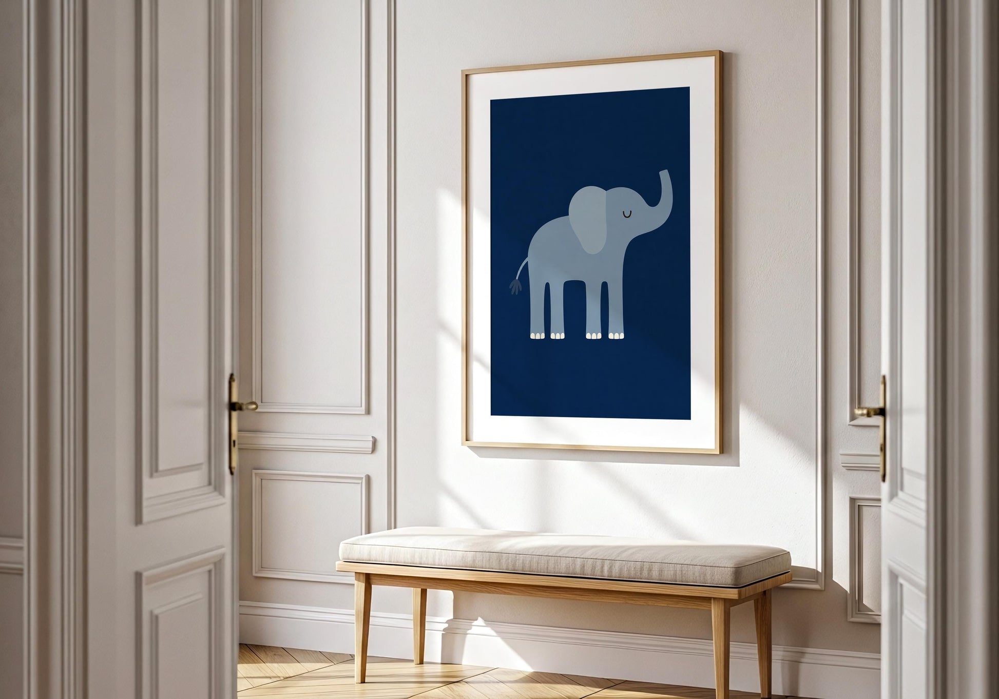 Modern safari nursery decor in navy, ochre and soft blue displayed above a light wood and white dresser.