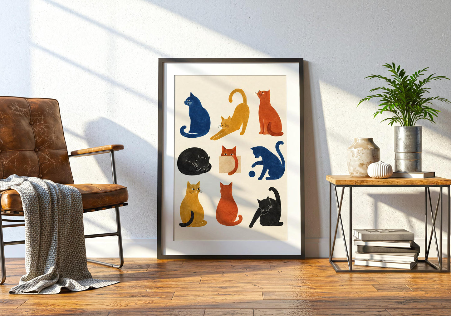Colourful feline wall decor featuring blue, orange, yellow and black cats in a simple graphic illustration style.