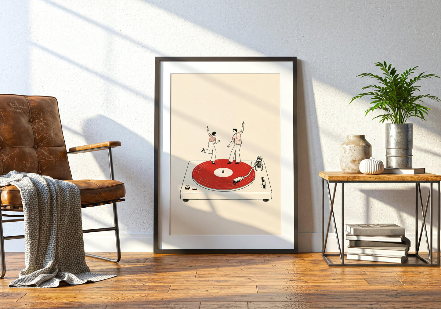 Framed vinyl record artwork displayed in a bright interior, featuring playful dancers and a retro turntable design.