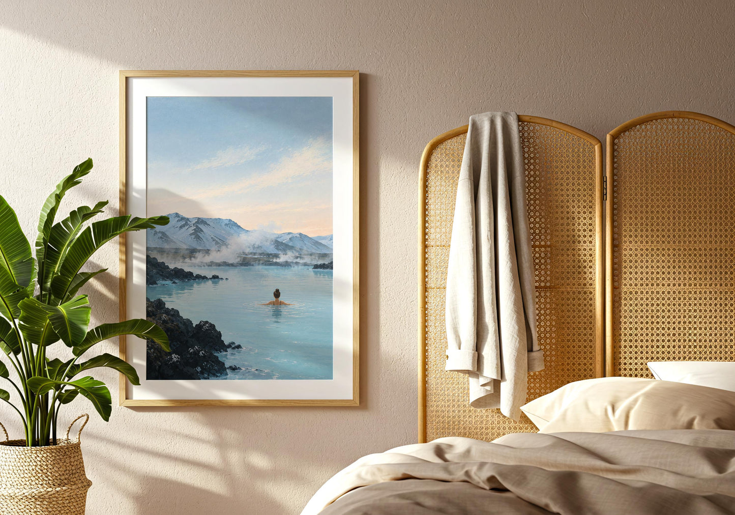 Nordic landscape print featuring steaming blue water, dark lava rock and a snow-covered mountain range beneath a pale sky.
