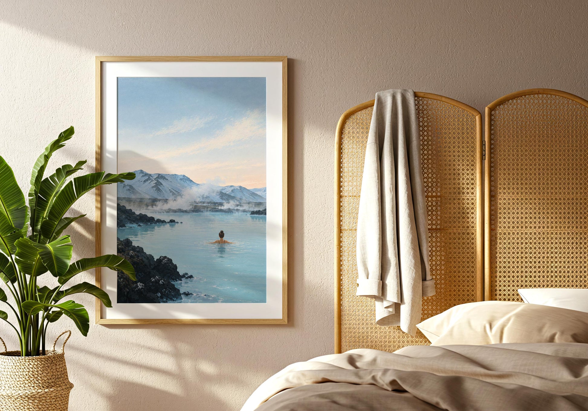 Nordic landscape print featuring steaming blue water, dark lava rock and a snow-covered mountain range beneath a pale sky.