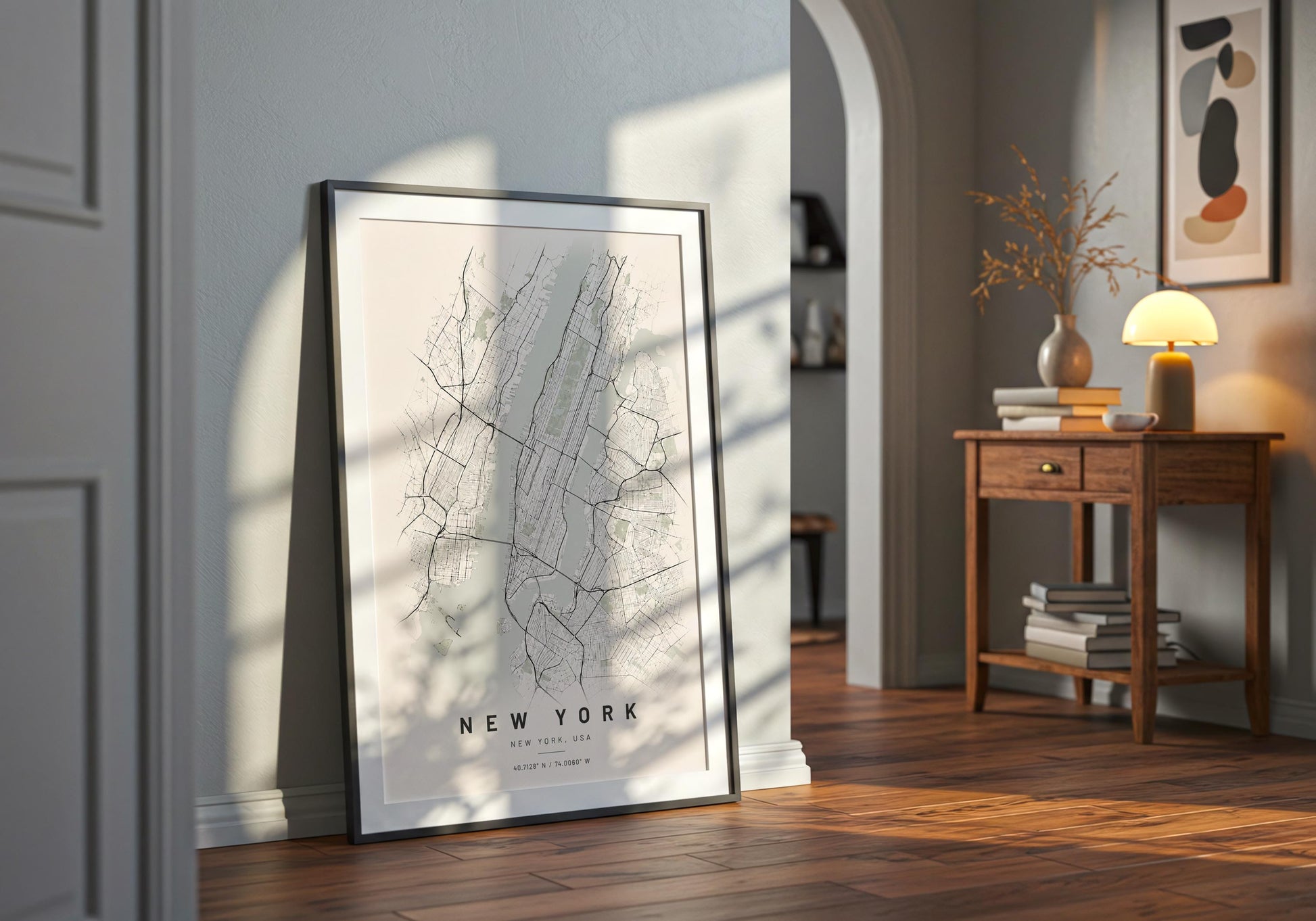 Framed neutral city plan artwork displayed against elegant white wall panelling with pale wooden flooring.