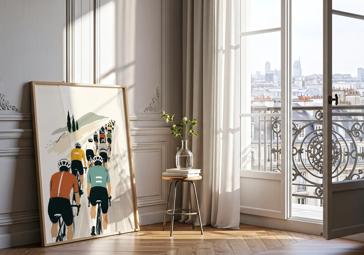 Framed cyclist print displayed against an elegant neutral wall with a natural wood frame.