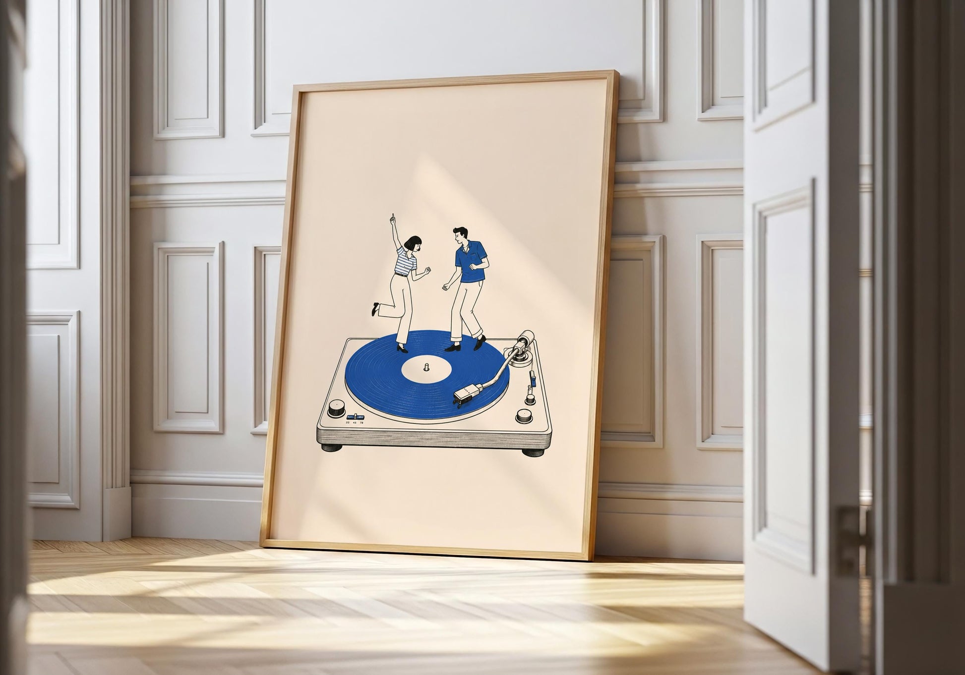 Retro couple wall art featuring two illustrated people dancing together on a large cobalt blue record player.