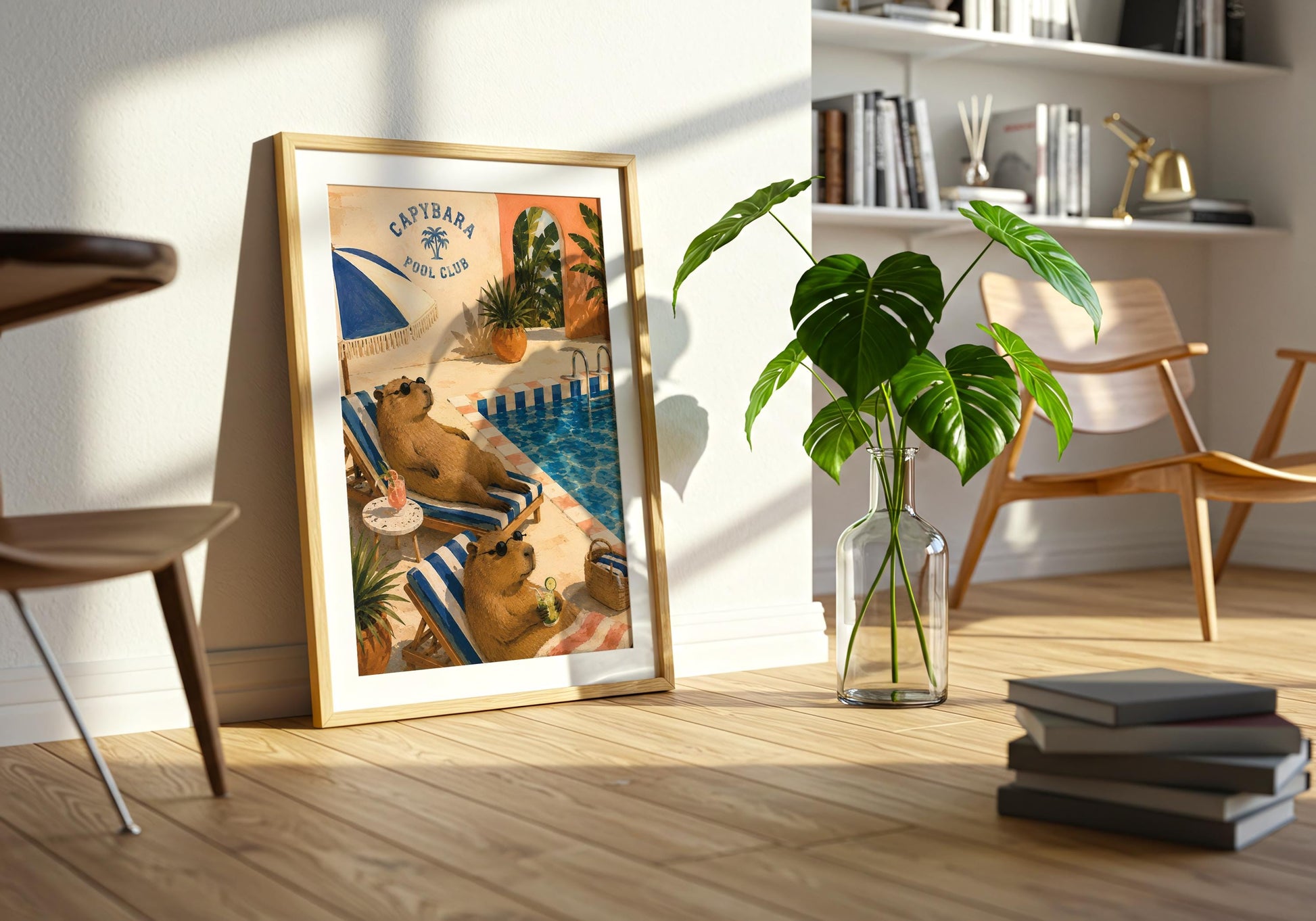 Retro tropical animal artwork in cobalt blue, peach and cream with capybaras enjoying a sunny swimming pool.