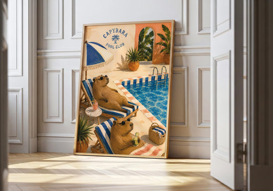 Retro capybara wall art showing two capybaras wearing sunglasses and relaxing on striped loungers beside a swimming pool.