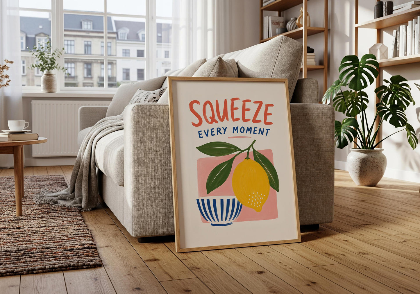 Cheerful lemon wall print in yellow, green, cobalt blue, coral and pink on a warm cream background.