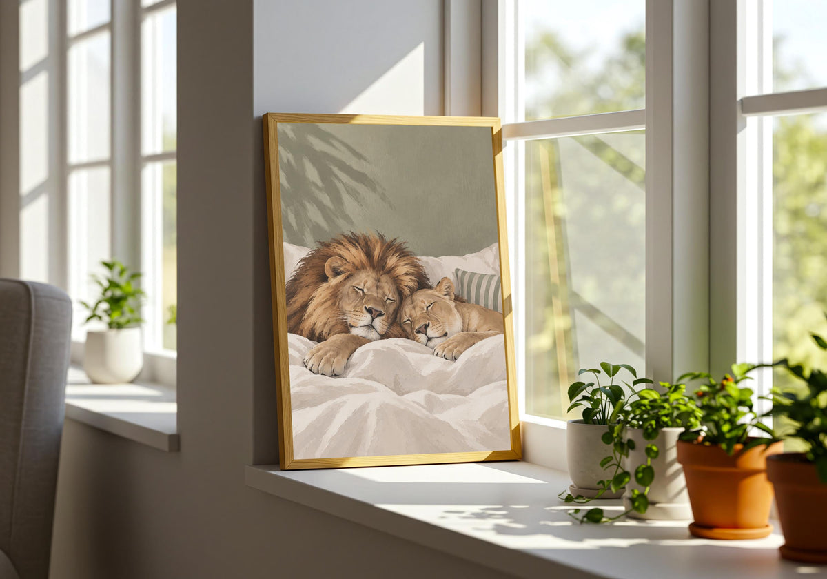 Styled Sleeping Lions art print featuring a lion and cub enjoying a peaceful bedtime cuddle, displayed in a bright room with healthy green plants.