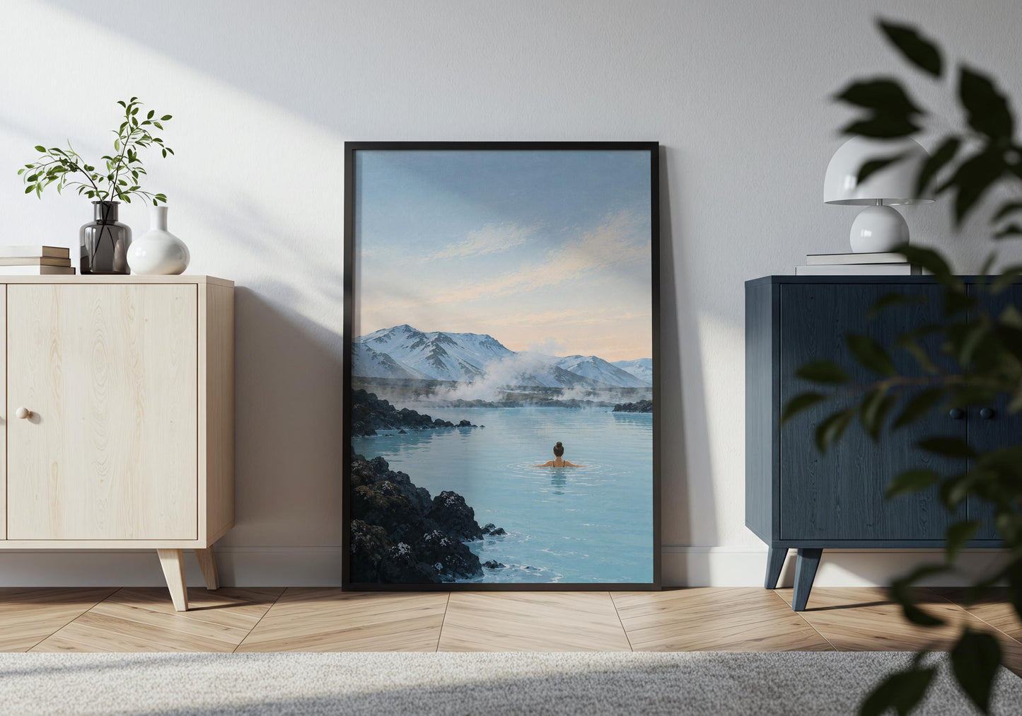 Scandinavian landscape wall art in icy blue, charcoal and white tones featuring volcanic rocks, steam and distant snowy peaks.
