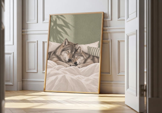 Sleeping Wolves sleeping couple print featuring two gentle wolves sleeping nose to nose in a cosy bed, leaning in a light natural-wood hero frame against bright white panelling.