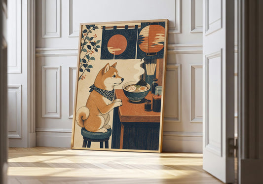 Shiba Inu ramen print showing a bandana-wearing dog beside a steaming noodle bowl, leaning in a light natural-wood frame against white panelling.