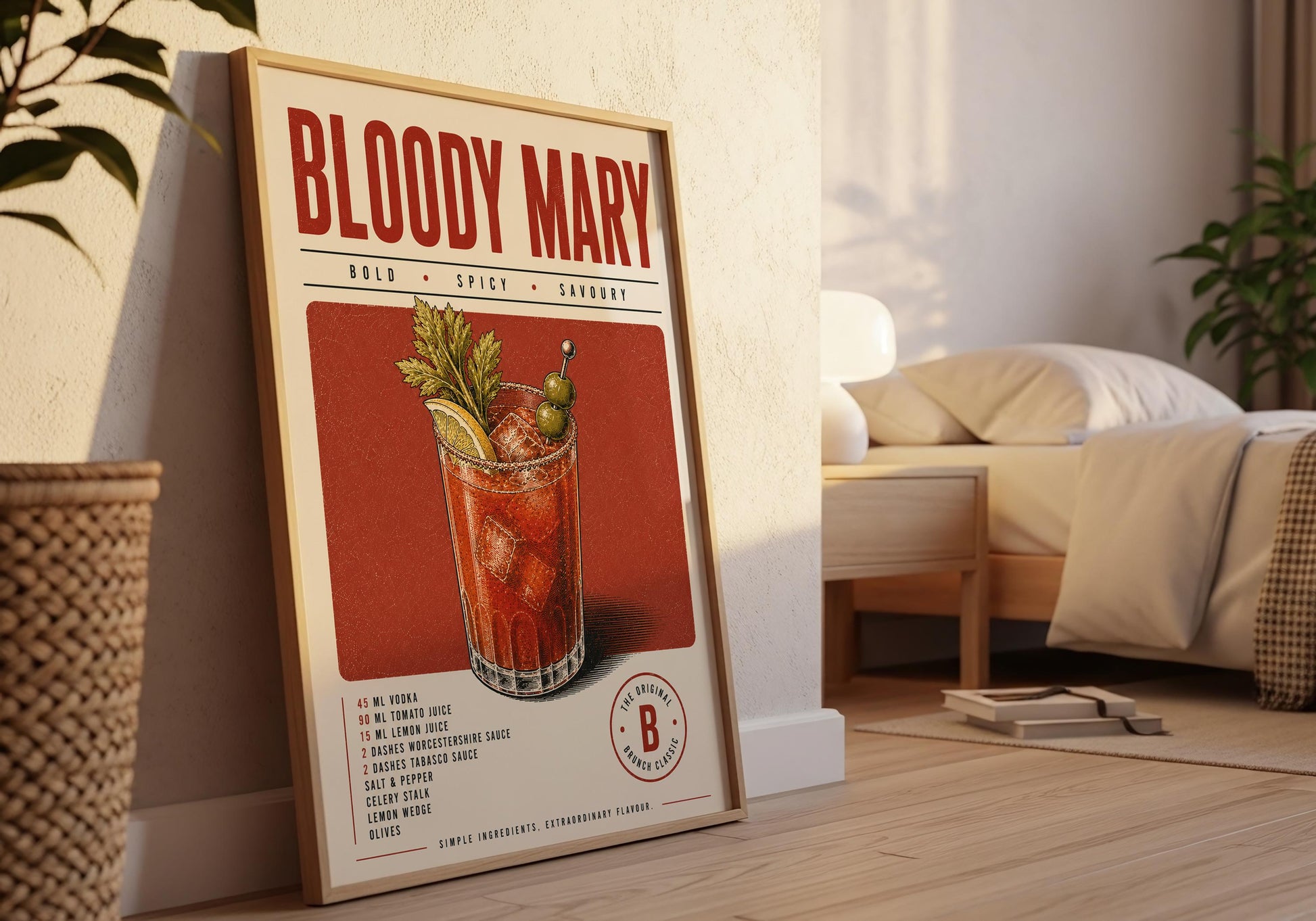 Framed Bloody Mary cocktail print displayed against elegant white wall panelling in a bright neutral interior.