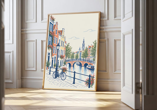 Amsterdam print showing a blue bicycle beside an Amsterdam canal, bridge and colourful Dutch houses, leaning in a light natural-wood hero frame against bright white panelling.