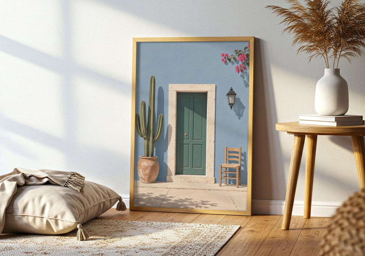 Room view of Blue Wall Green Door as architecture poster, leaning in a dark frame in a bright living room.