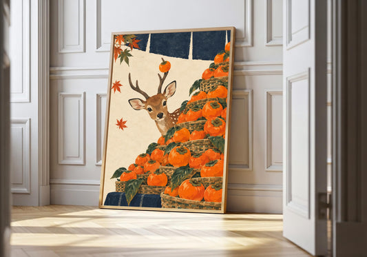 Nara Persimmon Market nara deer print in a light wood frame, featuring a curious Nara deer peering over vivid orange persimmons and autumn leaves.