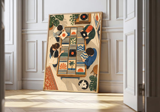 Record Shop Browsers record shop print in a light wood frame, featuring two people browsing vinyl among turntables, sleeves, plants and patterned rugs.