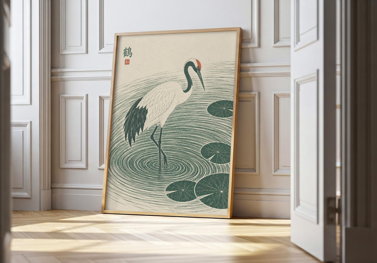 Japanese crane art showing a white crane stepping through deep green ripples and lily pads, leaning in a light natural-wood hero frame against white panelling.