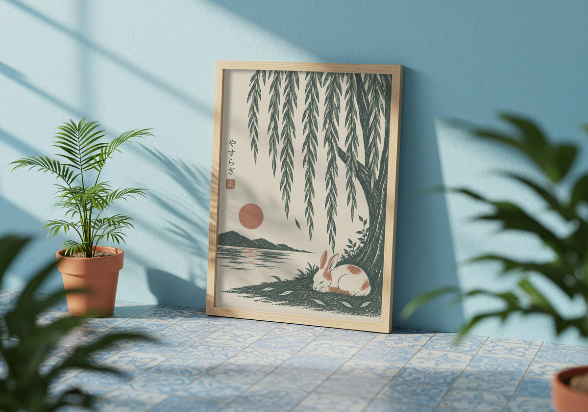 Calm wall decor showing a small white rabbit sleeping beside green water beneath long willow leaves, displayed in a pale frame among leafy plants.