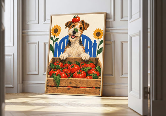 Terrier Tomato Harvest terrier kitchen art in a light wood frame, featuring a cheerful terrier wearing a tomato crown behind a crate overflowing with ripe tomatoes.