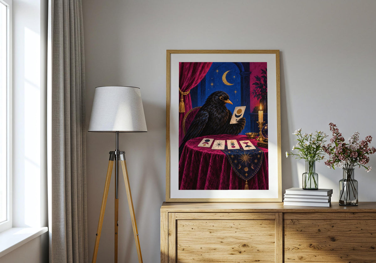 A modern interior displays the Blackbird Fortune Teller I poster with its inky black, magenta, cobalt and gold palette.