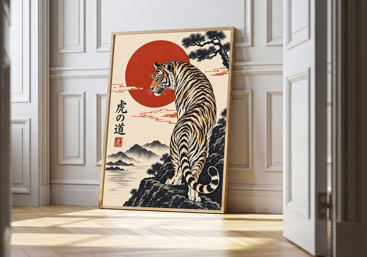 Tiger on the Mountain Path japanese tiger art in a light natural-wood hero frame, featuring a striped tiger climbing a rocky mountain path beneath a red sun, windswept pine and Japanese-style calligraphy.