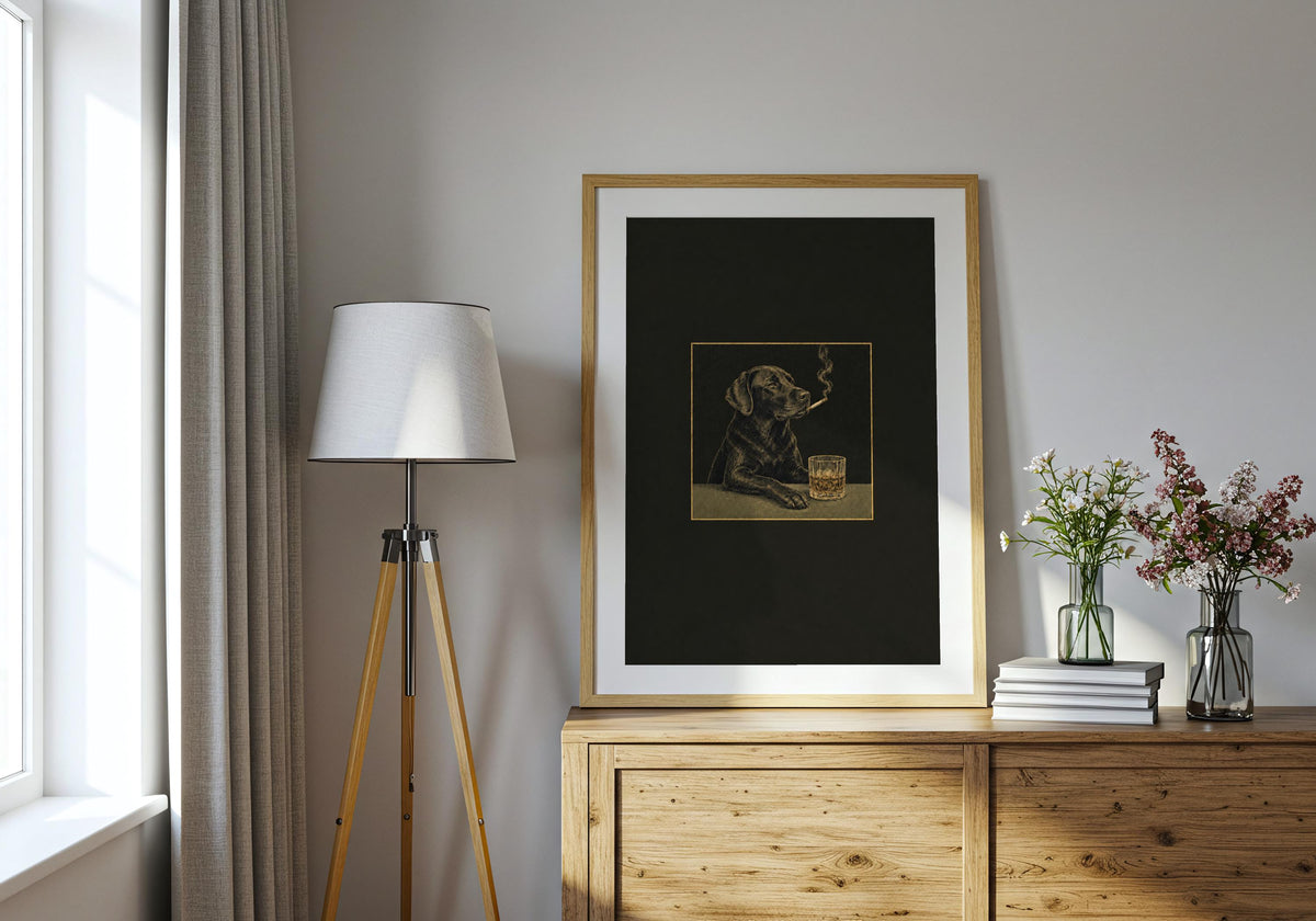 A modern interior displays the Labrador Cigar Club poster with its charcoal black, antique gold and muted olive palette.